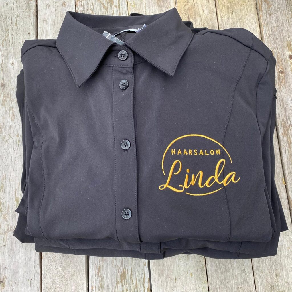 Logo geborduurd op jurk bedrijfskleding - vooraanzicht